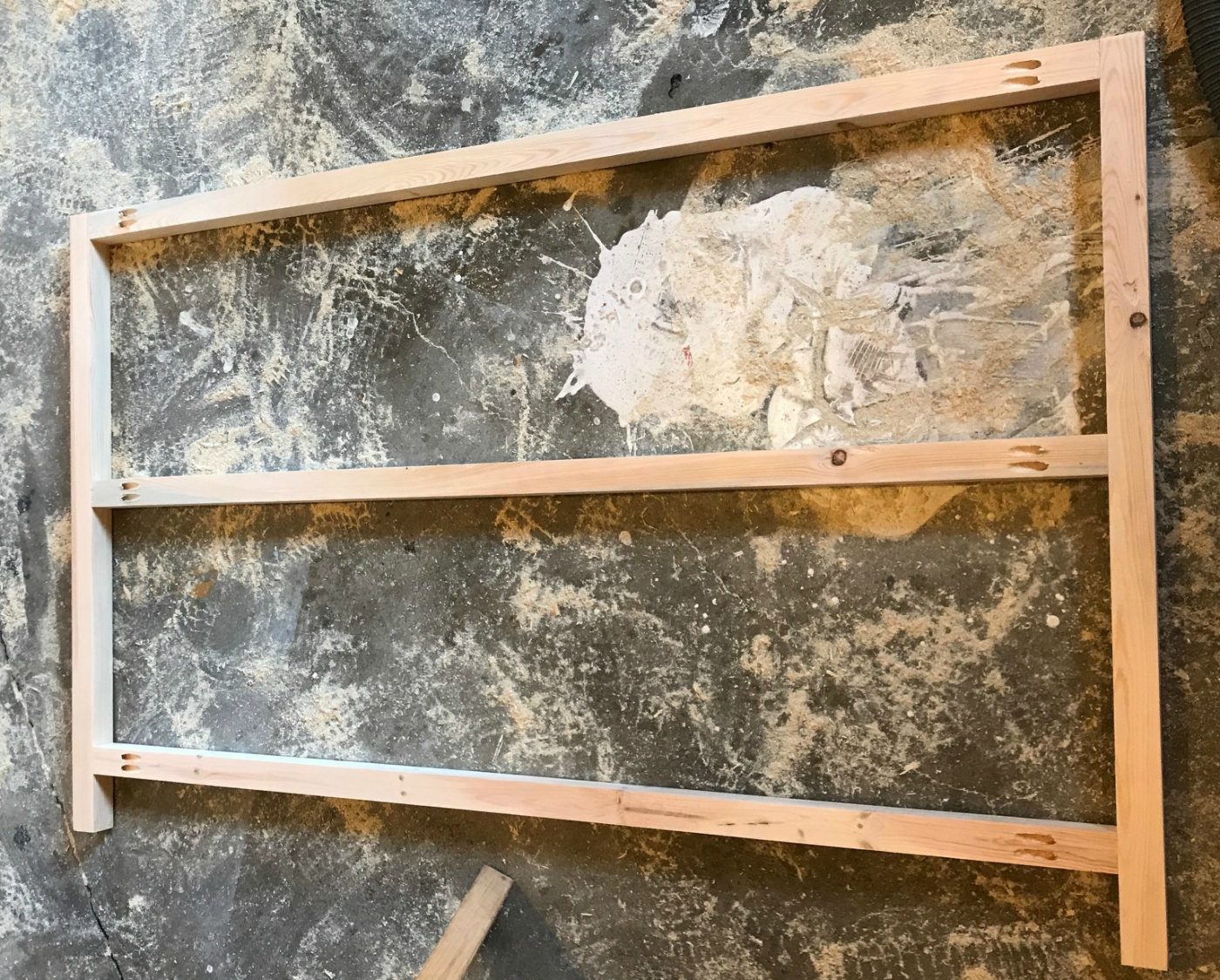 DIY X Base Console Table front and back frame assembled on workshop floor