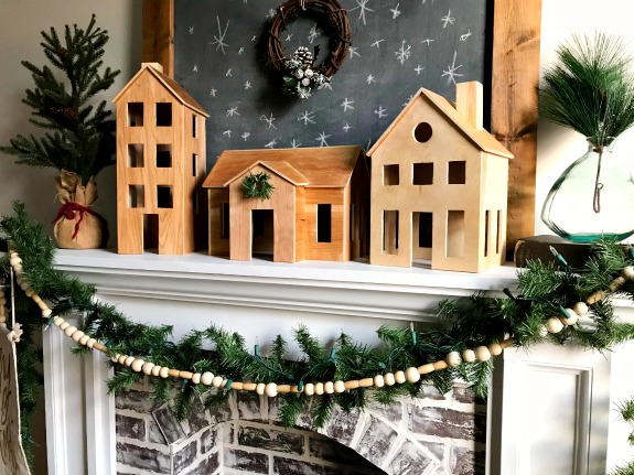 DIY Wooden Christmas Village Display perfect for a simple Scandinavian Christmas Mantle