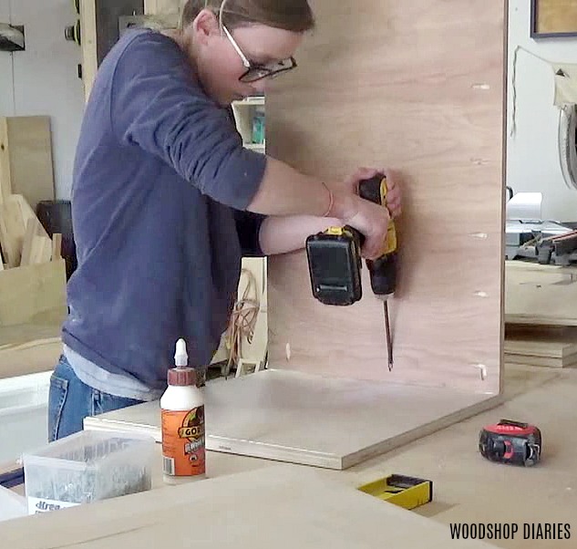 Shara Woodshop Diaries attaching side panels to bottom panel to build storage desk cabinets