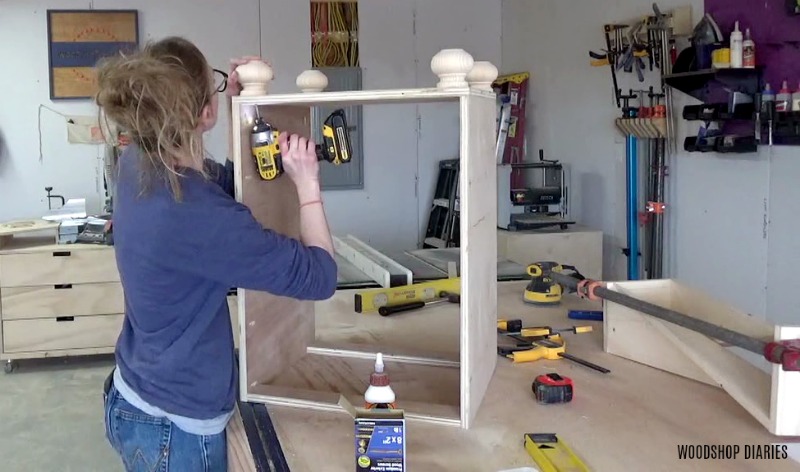 Shara Woodshop Diaries installing furniture feet to the bottom of desk cabinets