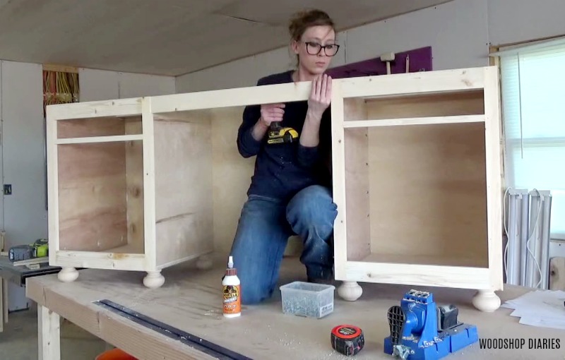 Shara Woodshop Diaries installing middle apron to assemble DIY storage desk