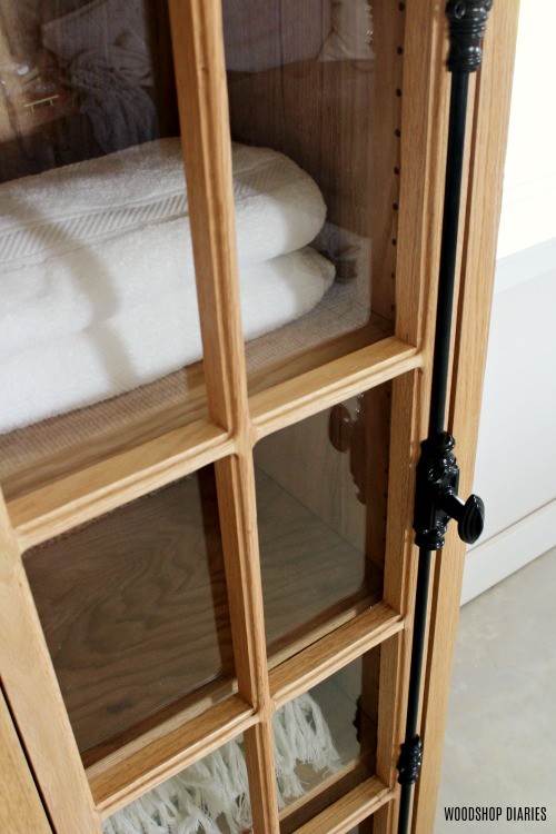 Close up of cremone bolt on DIY linen cabinet built