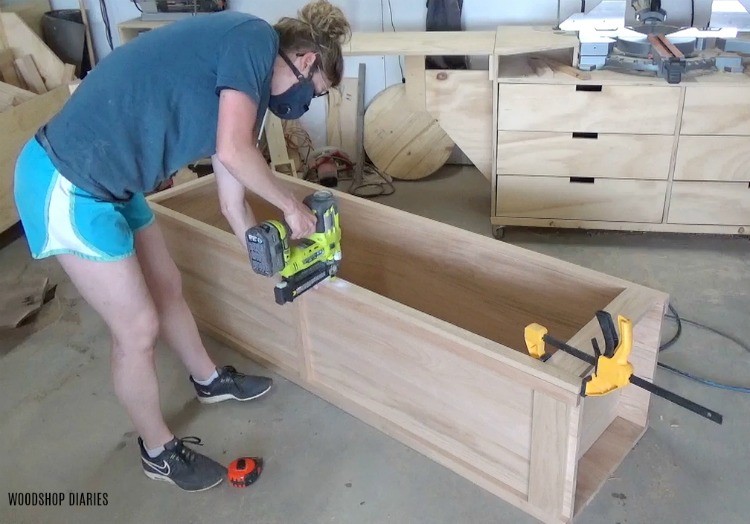 Shara Woodshop Diaries nailing face frame on front of linen cabinet project