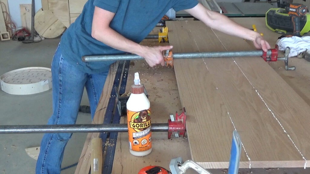 Shara Woodshop Diaries gluing up red oak boards into a solid panel