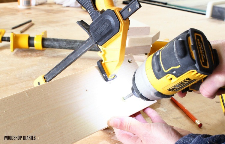 drive screws to attach DIY pipe clamp rack dividers