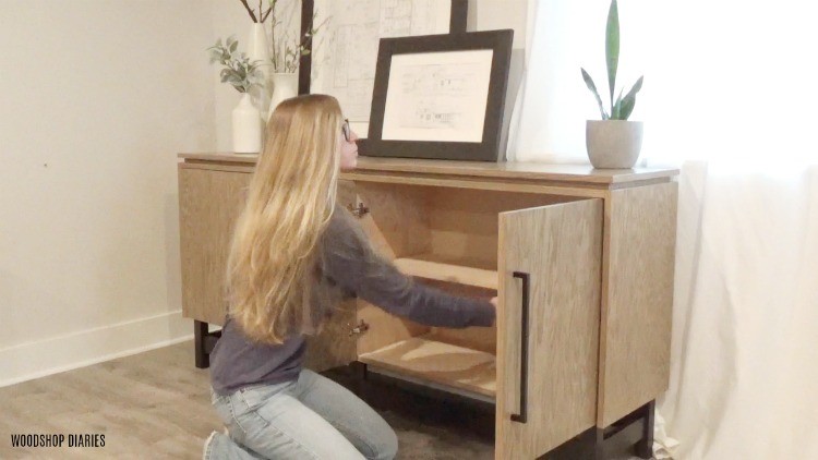 Shara adding shelf into console cabinet