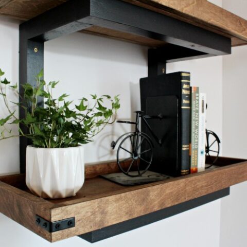 Close up of industrial details of DIY scrap wood wall shelf