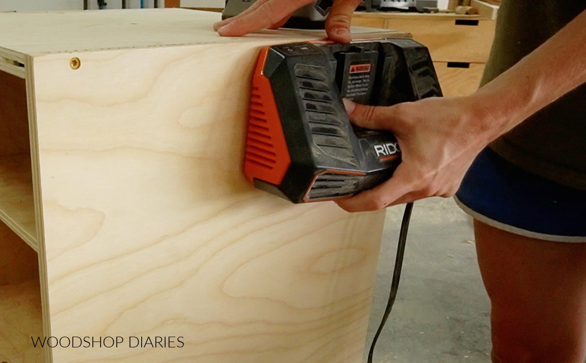 mounting battery charger on side panel of charging station