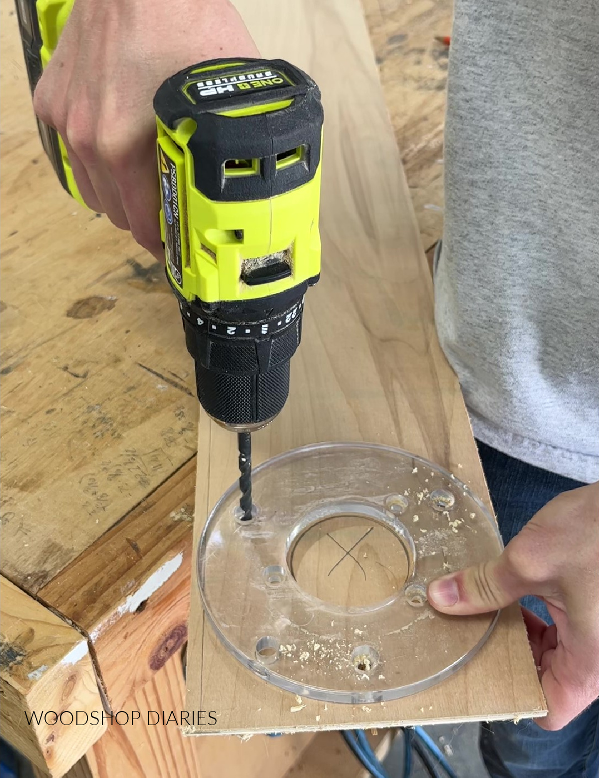 Drilling holes through sub plate holes into jig