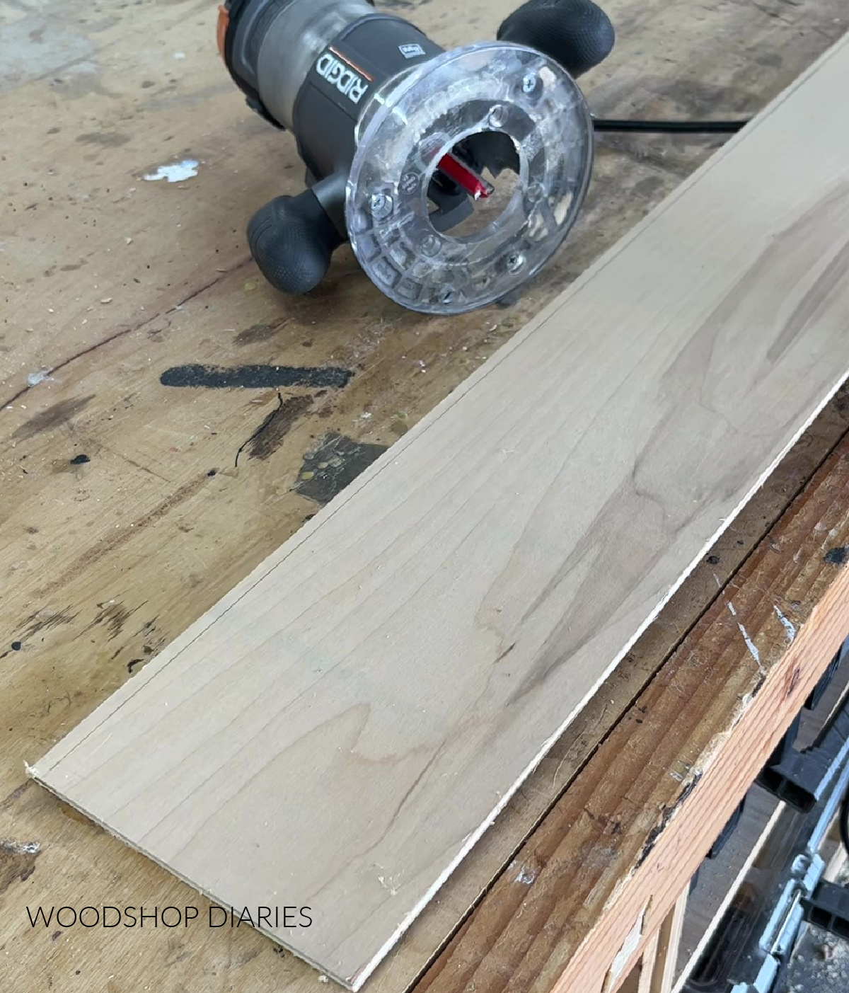 router on workbench next to ¼" plywood scrap to be used as jig material