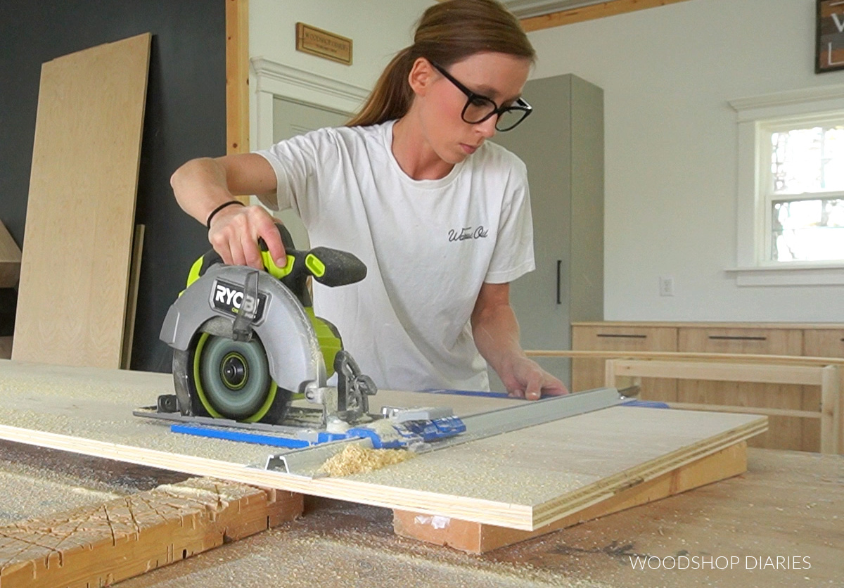 Shara Woodshop Diaries cutting plywood on workbench with circular saw