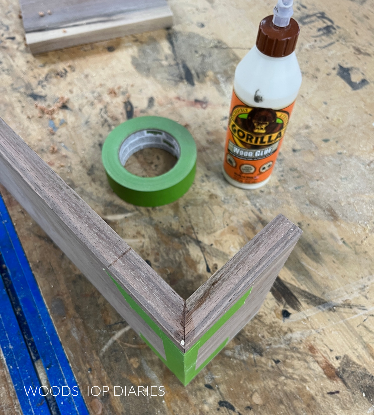 "Folded over" mitered wood joint with glue and tape 