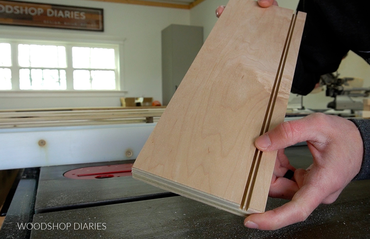 plywood drawer box side with two blade cuts