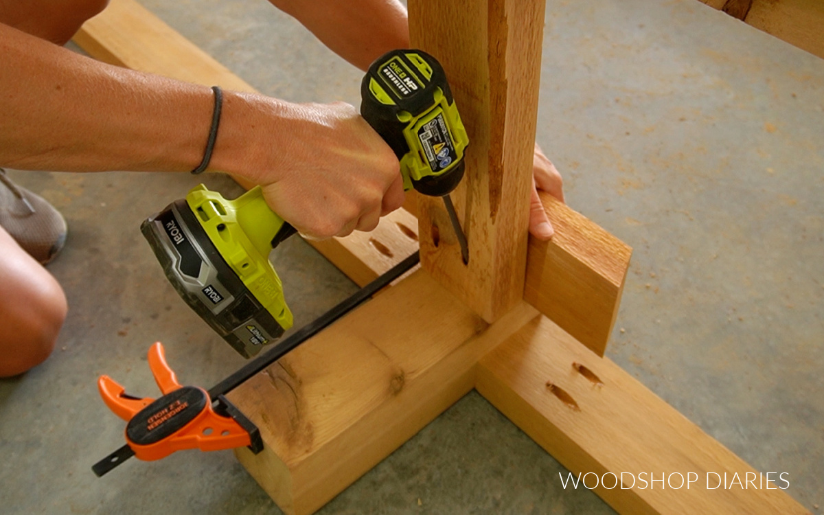 Installing middle support brace to front support leg