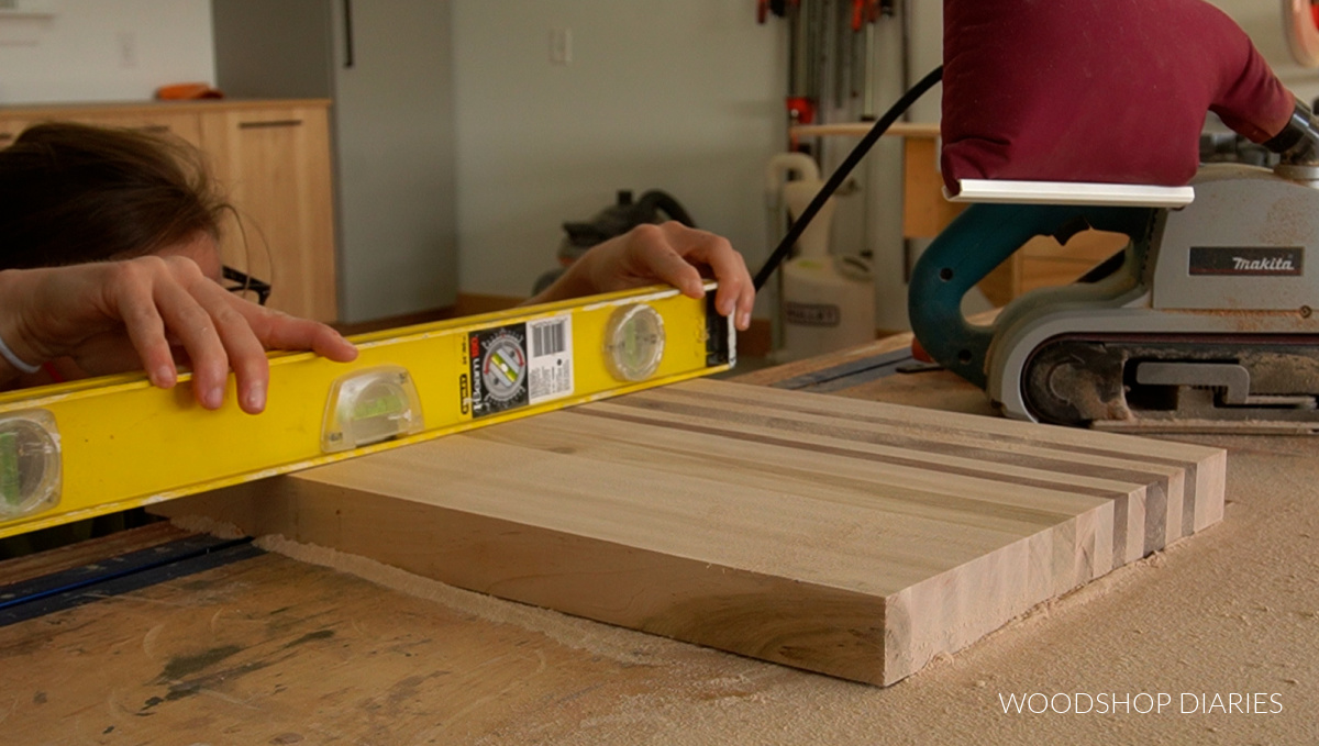 using a level to check flatness of cutting board