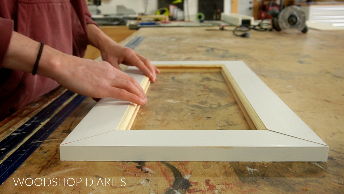 mitered corner cabinet door pieces fit together on workbench