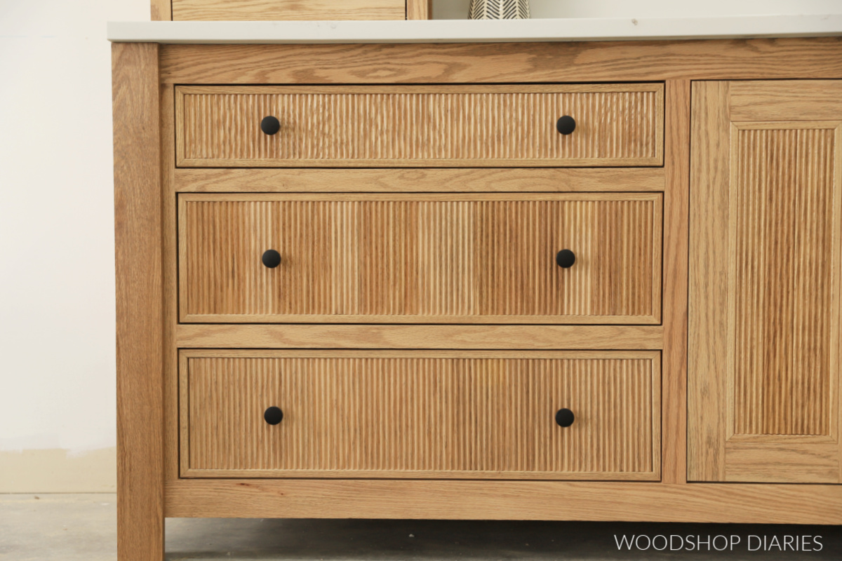 Red oak vanity with three fluted drawer fronts