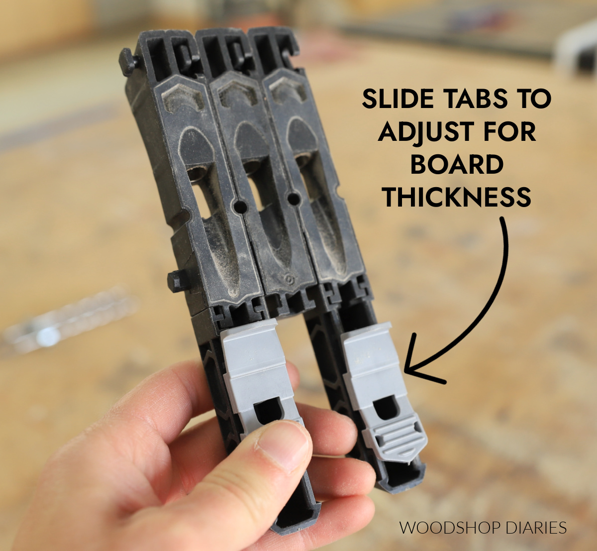 Close up of sliding tabs on back side of Kreg Micro pocket hole jig