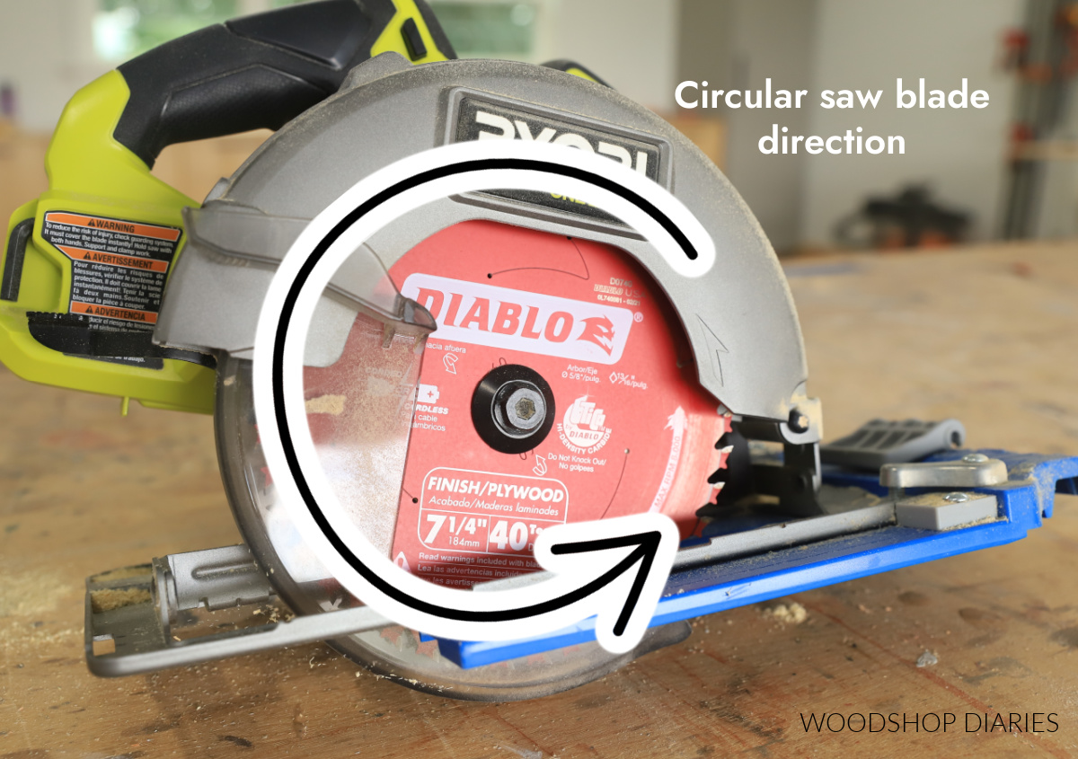 Arrow on circular saw blade showing cut direction