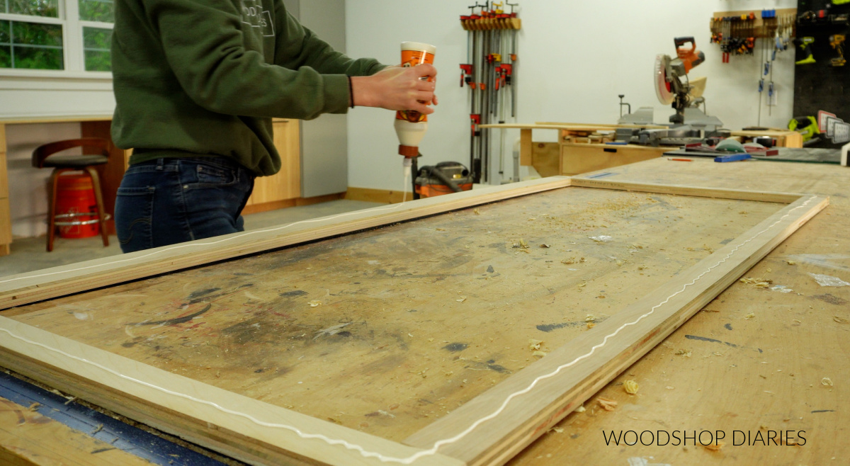 Shara Woodshop Diaries applying glue to plywood frame