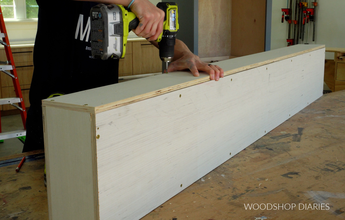 Securing back panel to plywood cubby shelf