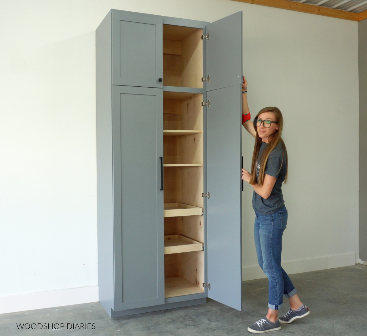 Shara Woodshop Diaries opening pantry cabinet doors showing adjustable and pull out drawer shelves inside
