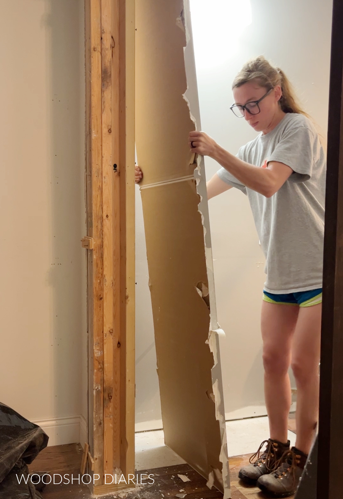 Shara Woodshop Diaries ripping drywall off closet framing in bathroom remodel