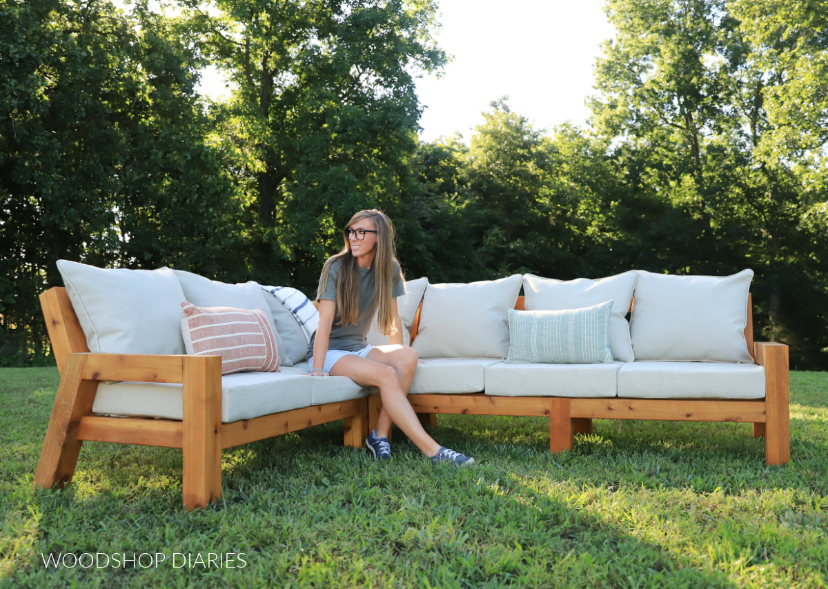 Shara Woodshop Diaries sitting on DIY outdoor sectional sofa