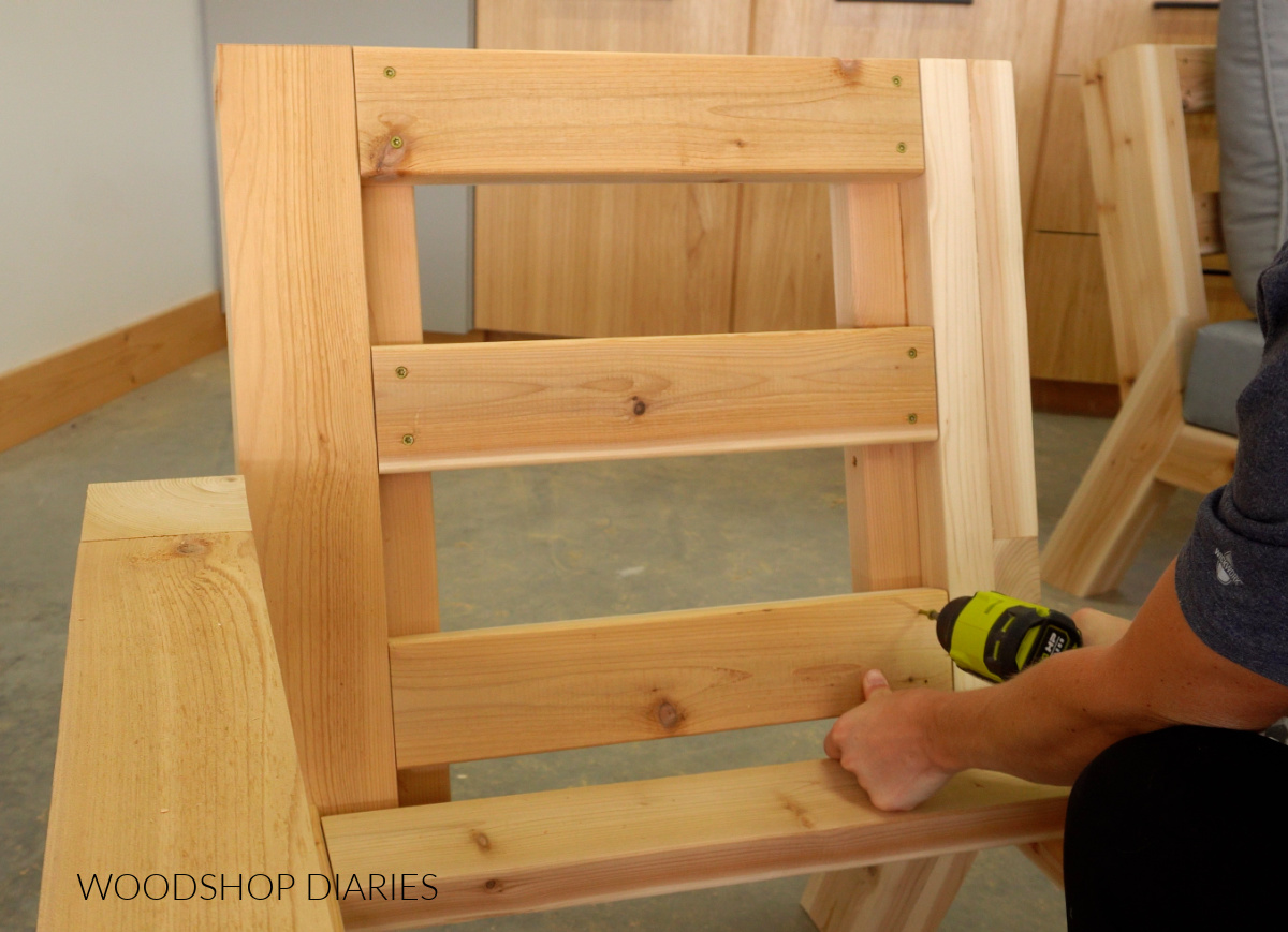 Shara Woodshop Diaries screwing back slats onto chaise part of sectional