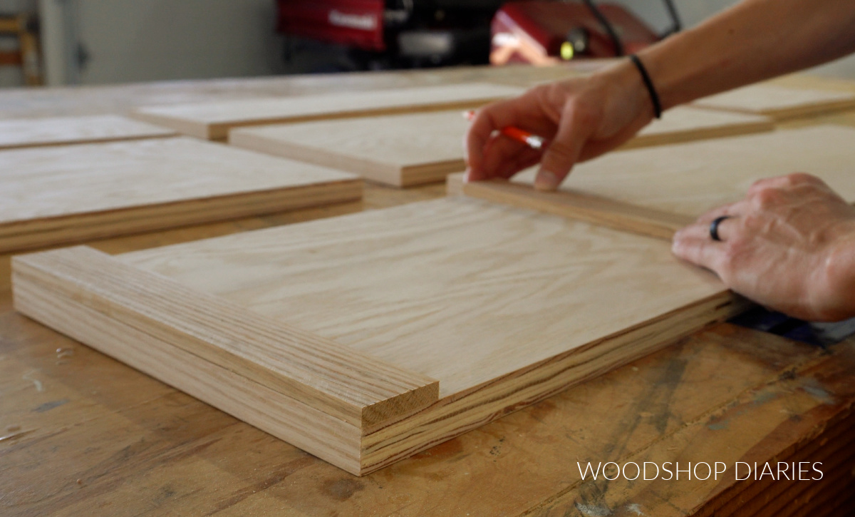 Close up of gluing trim pieces onto dresser drawer fronts