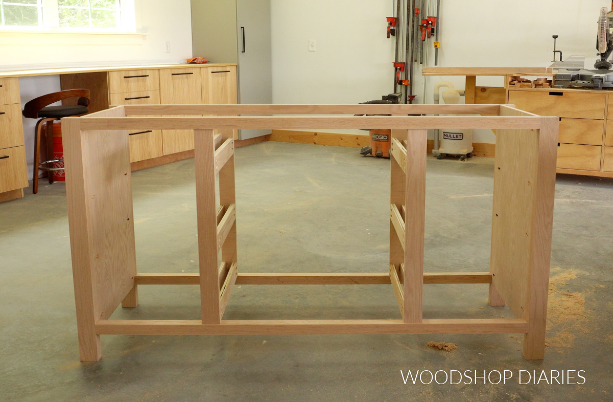 drawer slide runners installed in red oak dresser frame in workshop