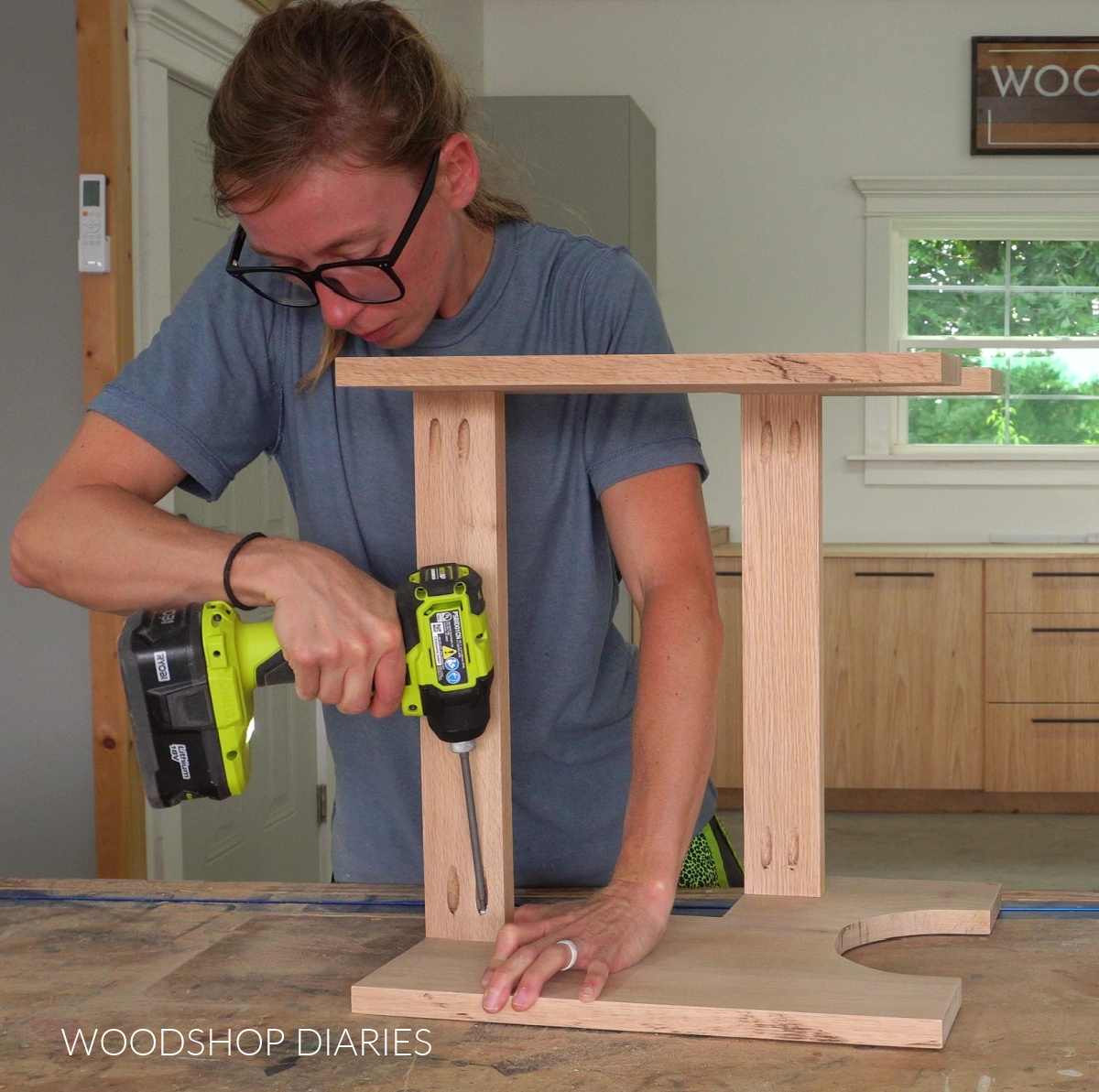 Shara installing support strips between plant stand sides