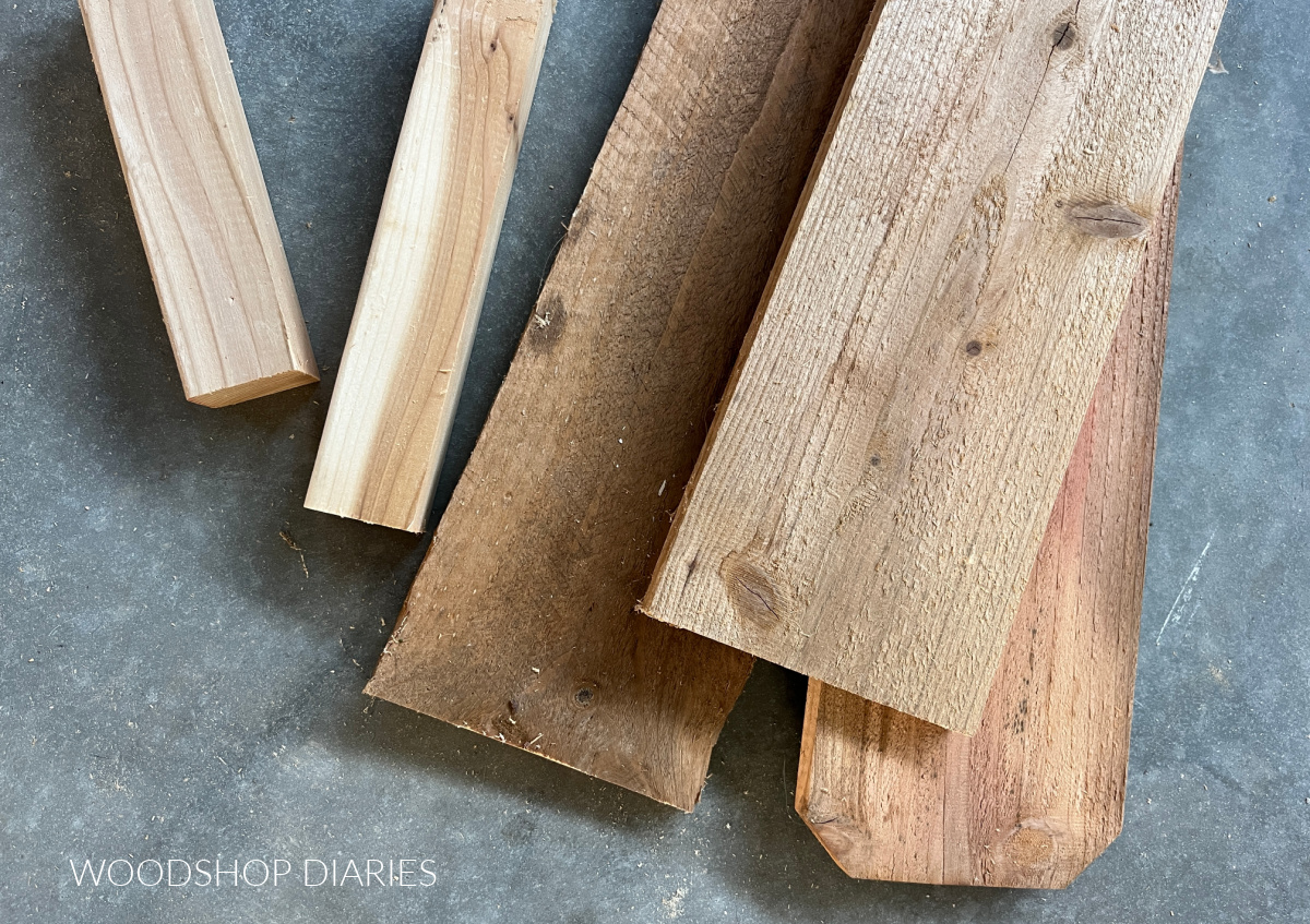 cedar fence pickets and 2x2 lumber on concrete floor