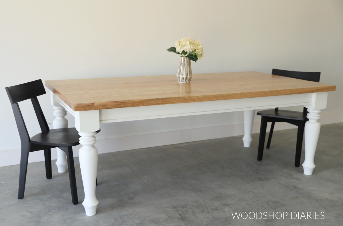 Finished two tone classic DIY dining table with four chunky table legs and large table apron with wood stained red oak table top
