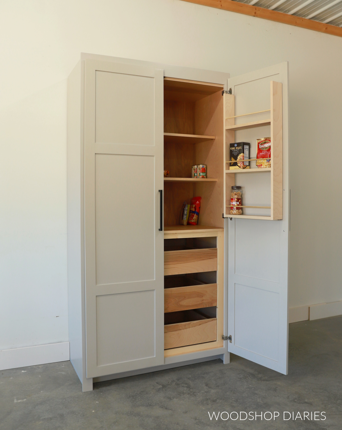 Finished Kitchen Pantry Cabinet with right door open--shelves on door have food items