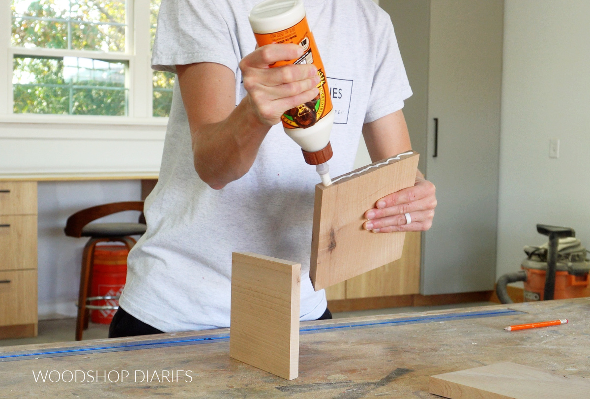 Shara Woodshop Diaries applying wood glue to board end