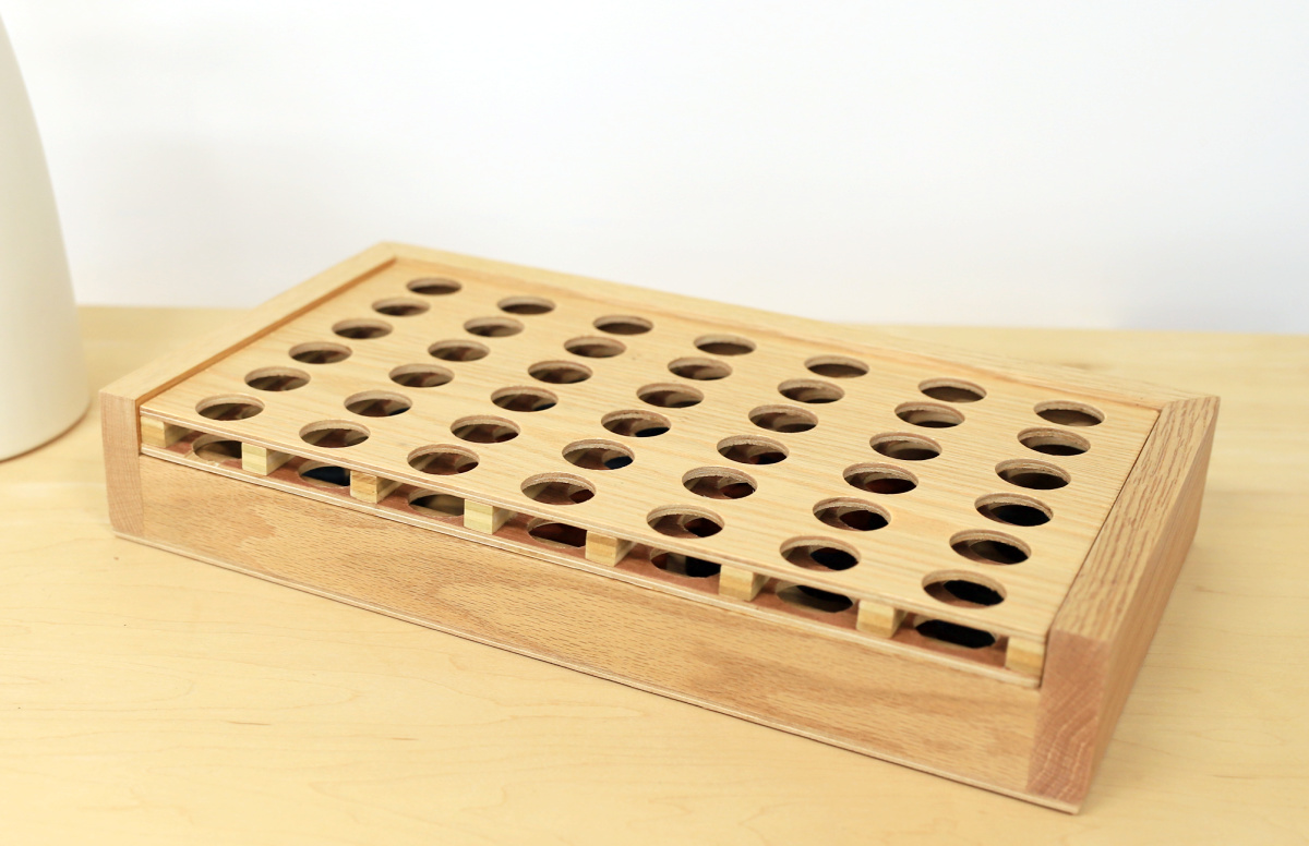 4 in a row game board placed inside storage box
