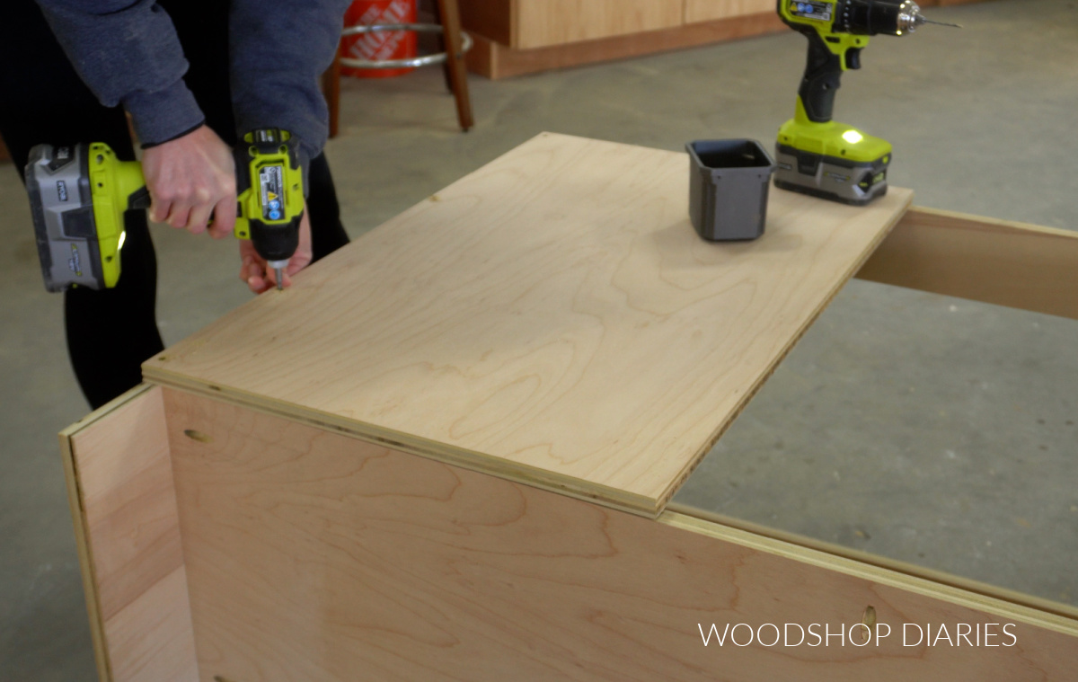 Shara Woodshop Diaries attaching front panel onto blind corner cabinet on left side