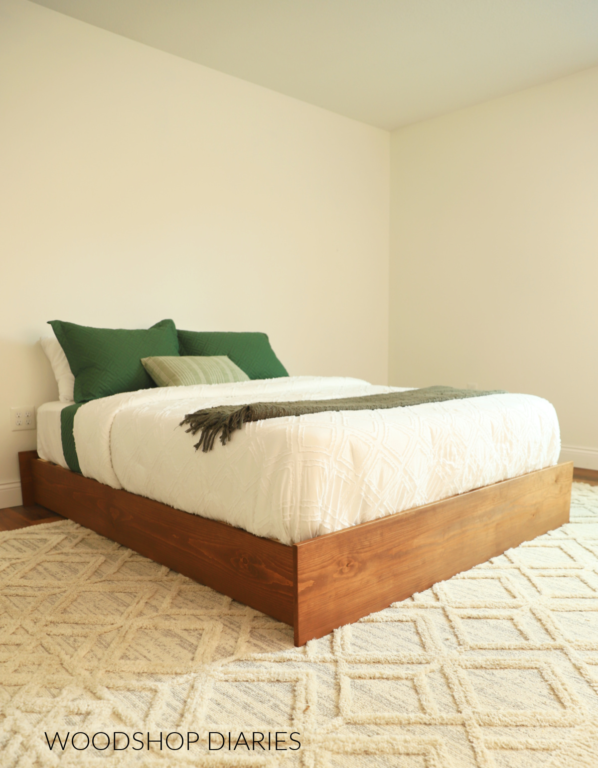 DIY Wooden Platform Bed Frame made with 1x12 construction lumber with white bedding--simple, modern bed frame