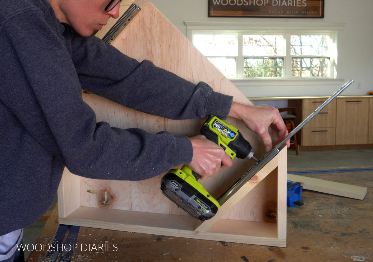 Shara Woodshop Diaries installing drawer slides into corner desk frame on workbench
