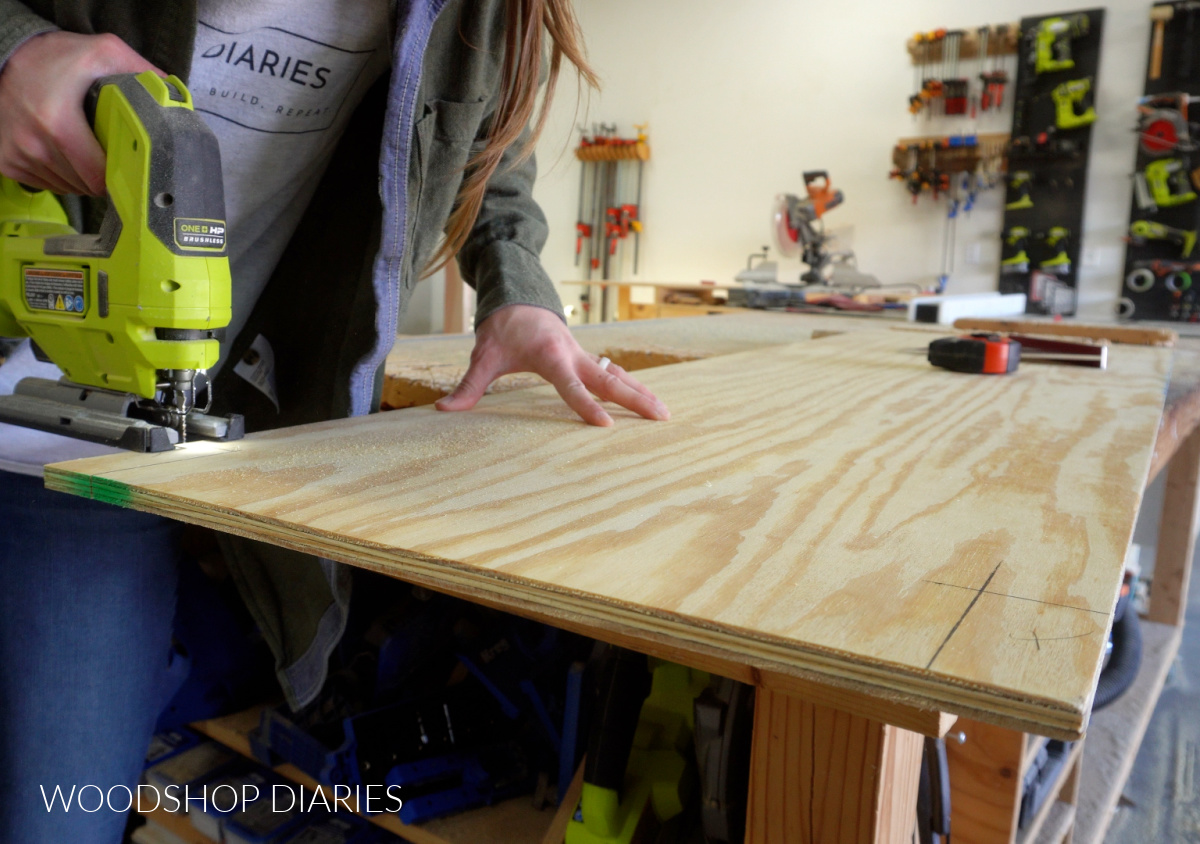 Close up of Shara Woodshop Diaries cutting corner shelf notches with jig saw