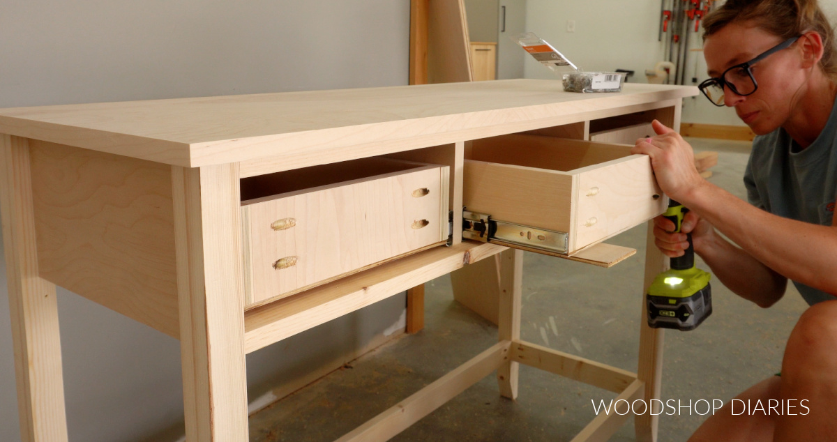 Shara Woodshop Diaries installing drawer boxes into console table frame onto drawer slides
