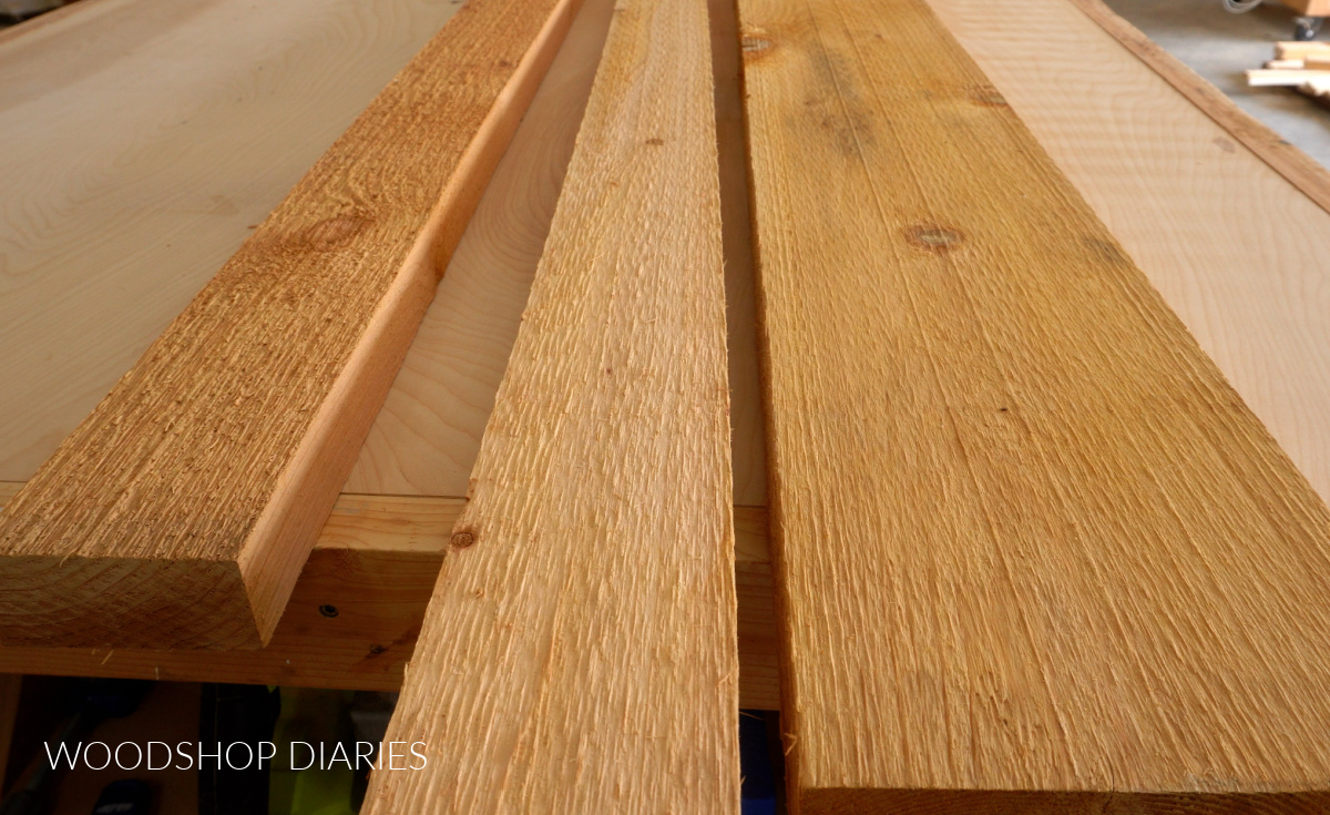 Close up photo of cedar boards used to build driveway gates