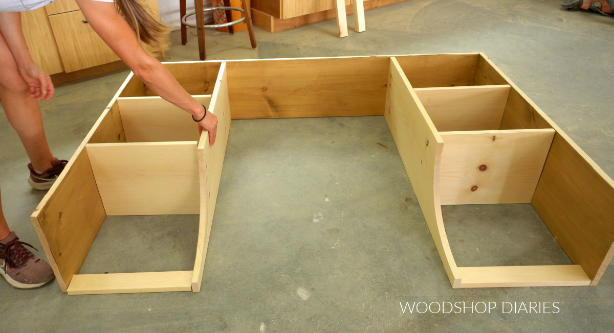 Shara Woodshop Diaries dry fitting hutch dividers and shelves together on workshop floor