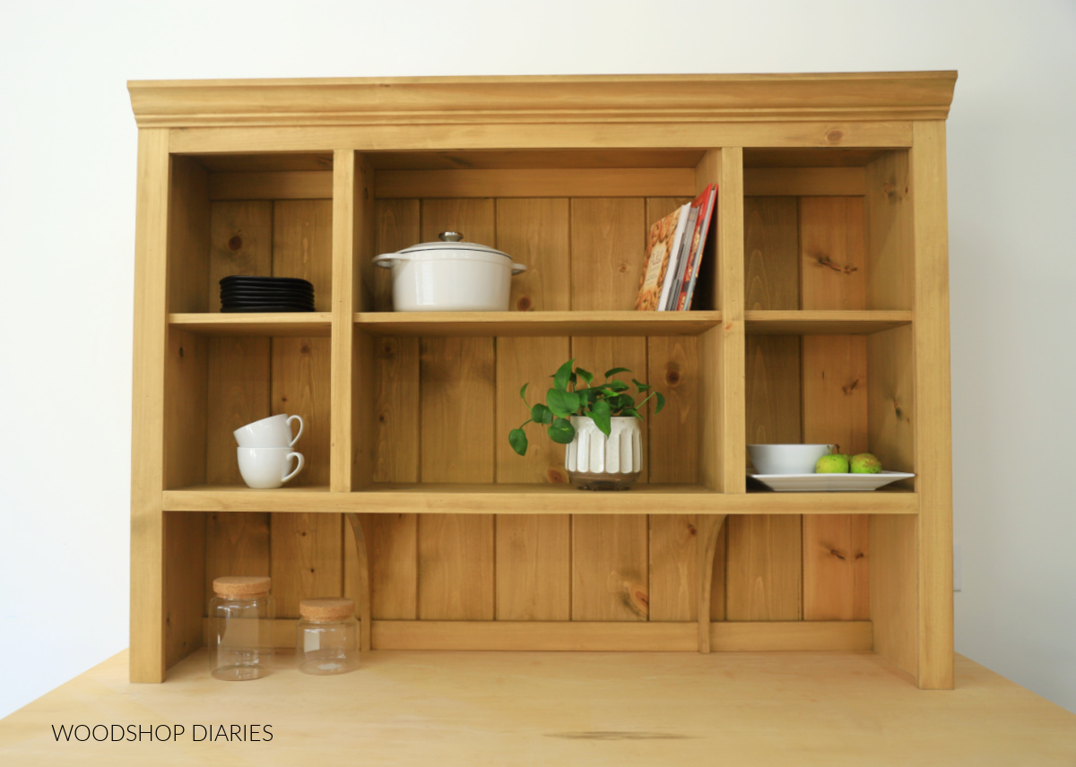 Wooden countertop hutch with crown molding and shiplap back 