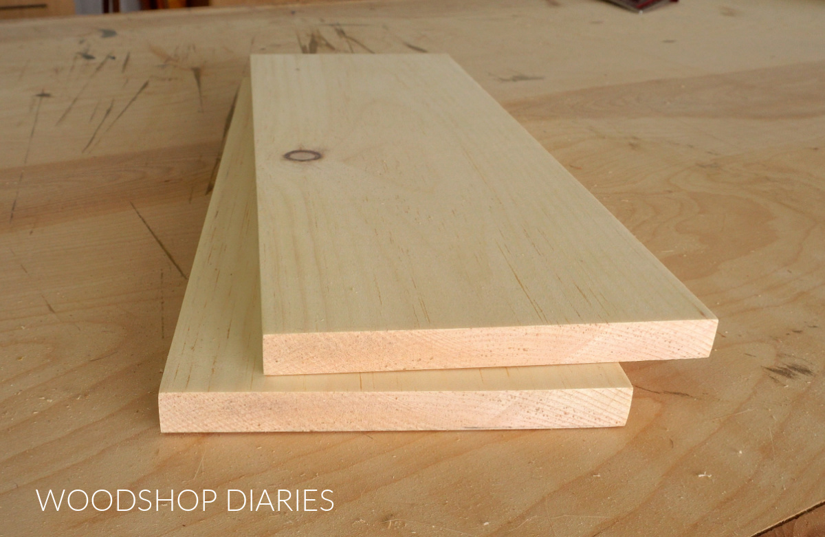 1x whitewood boards stacked on workbench