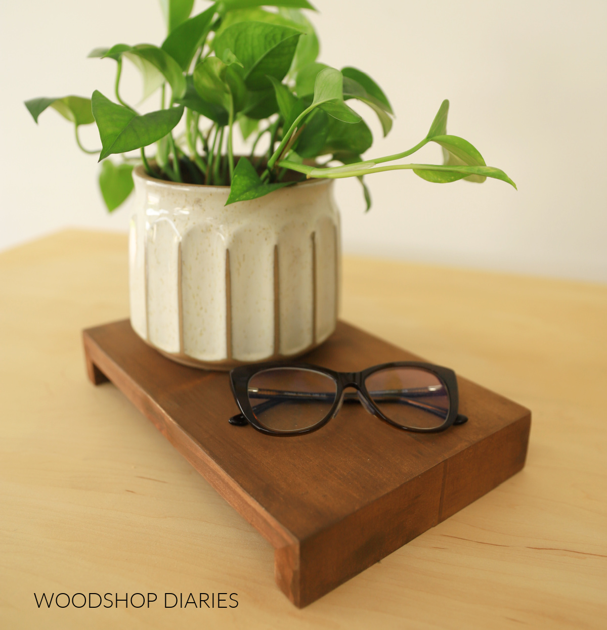 Finished wooden riser with continuous grain waterfall edge stained dark brown