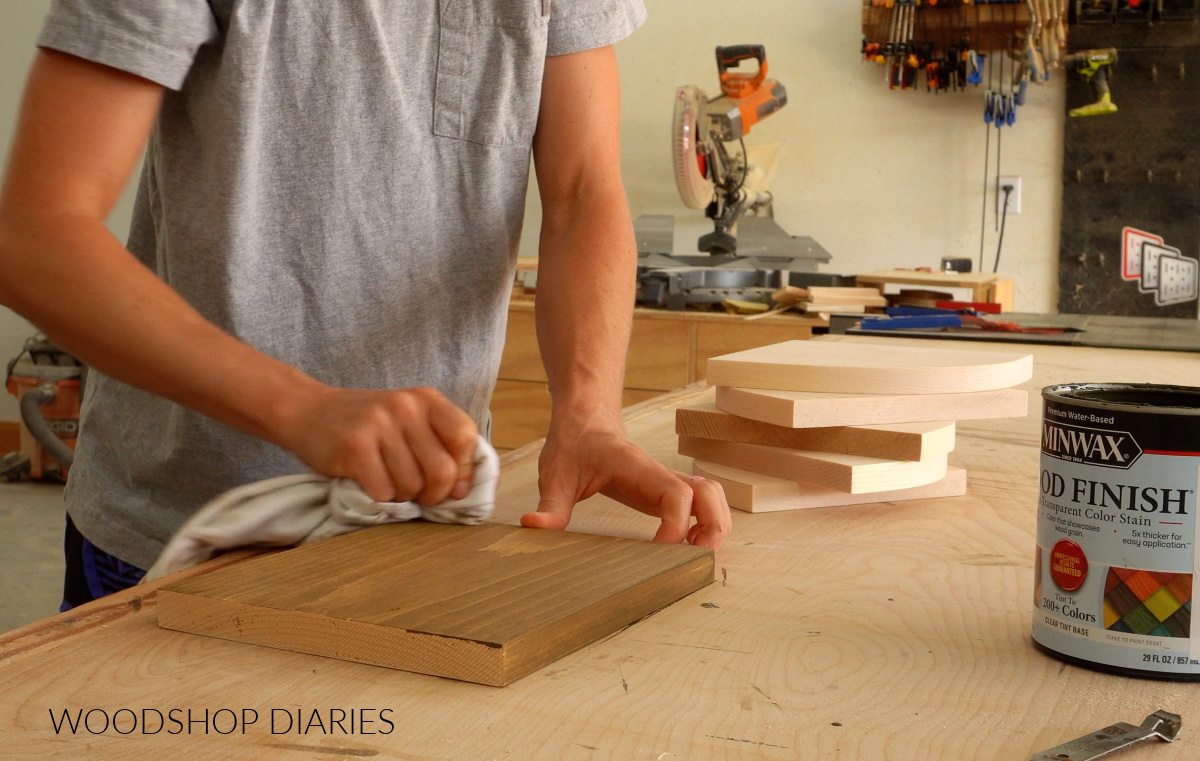Shara Woodshop Diaries staining pine boards on workbench