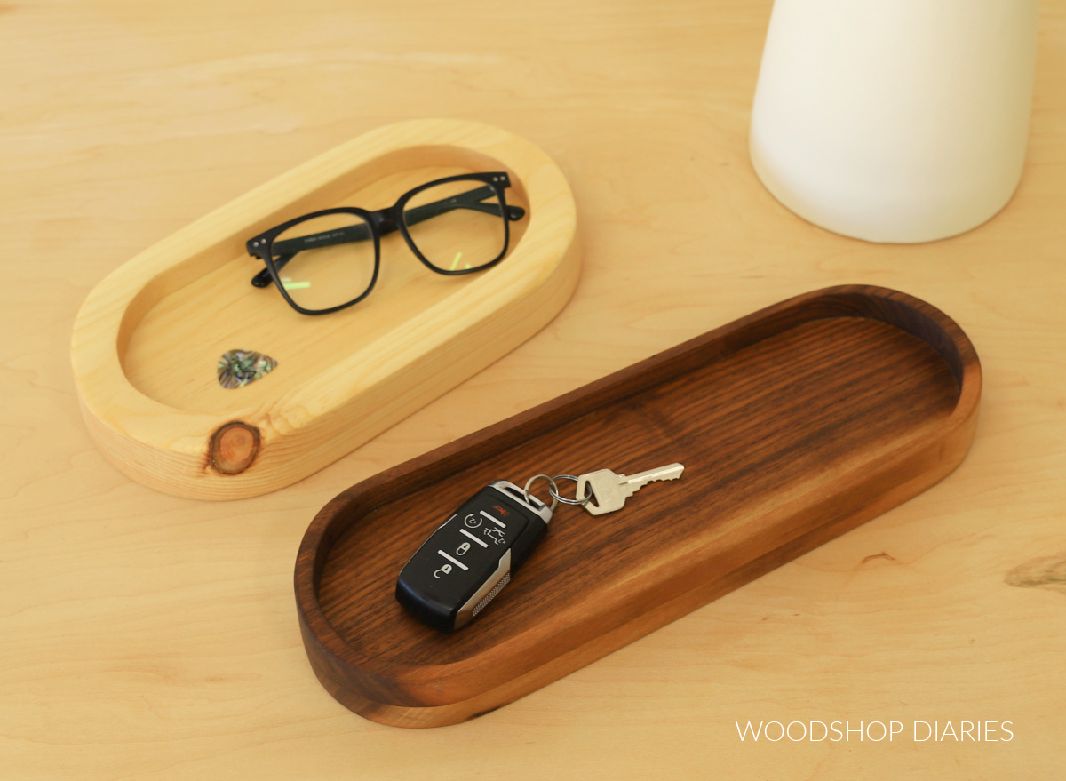 Simple wooden oval shaped catch all trays made from pine and walnut wood