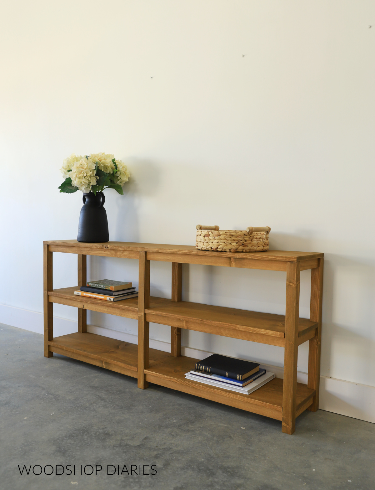 Medium wood ton console table with open shelving